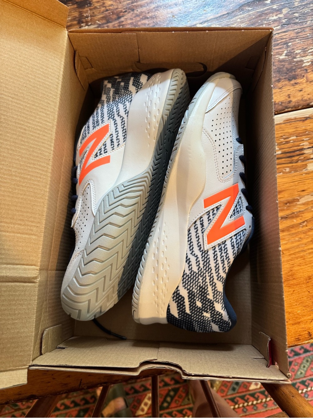 New Balance Men’s White & Orange Tennis Shoes with Navy Pattern